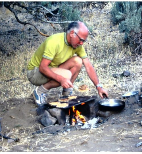 Chuck Leach cooking a group dinner at river camp.