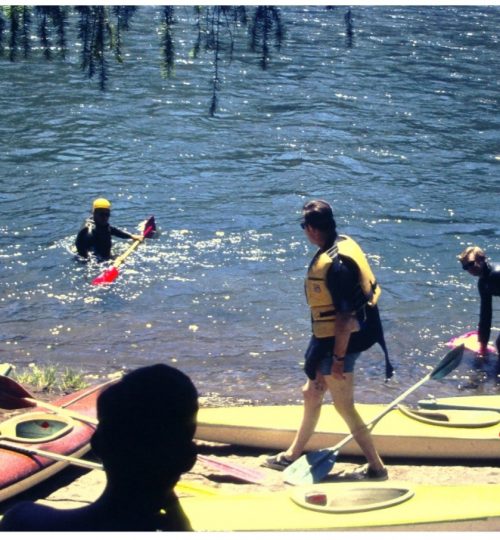 Fiberglass kayaks & wetsuits. All boats were 4 m (13 ft, 2 in) long. Note that paddles were 90 degrees feather. OKCC trip on the N. Santiam River.
